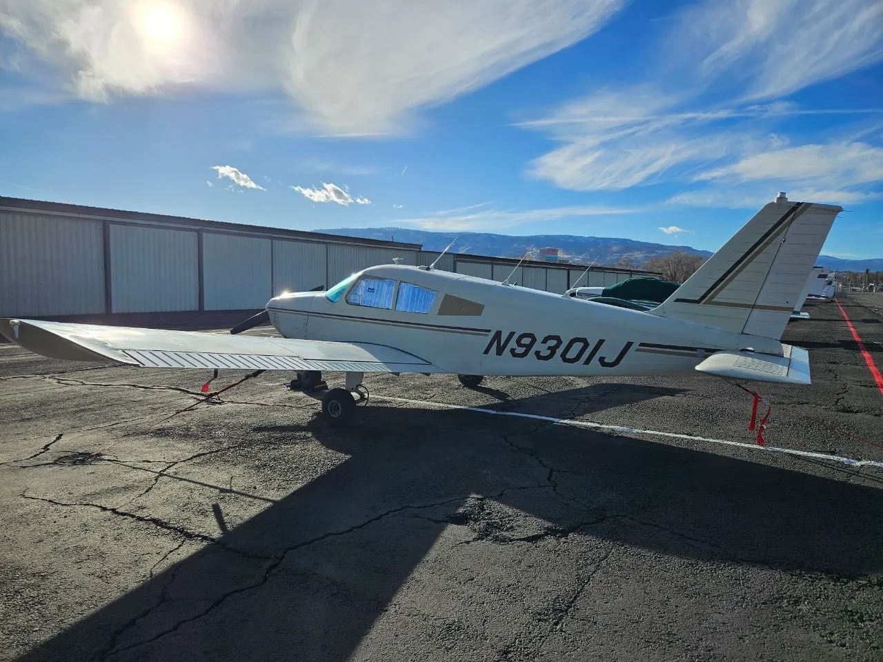 Piper Cherokee 180 N9301J parked on ramp